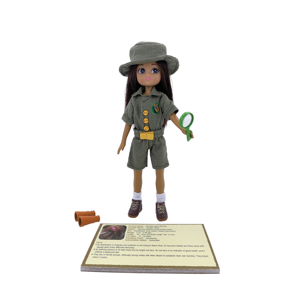 Toy Lottie doll in explorer outfit with hat, shorts, and shirt on a white background