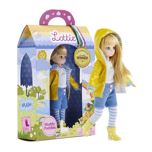 The box for the Muddy Puddles Lottie Doll, showing off a doll with blonde hair wearing a yellow rain coat and welly boots
