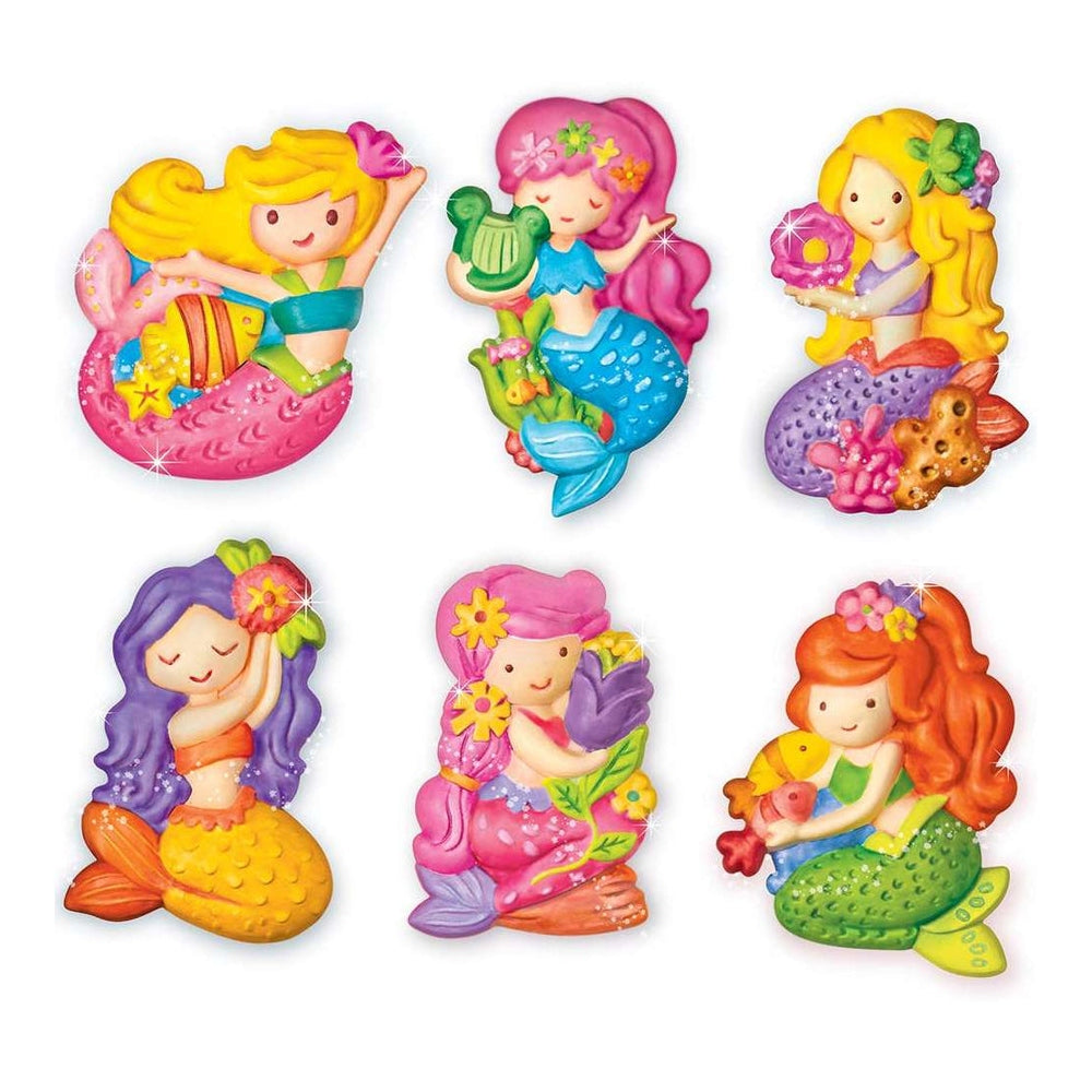Six colourful mermaid-shaped decorative items arranged in two rows on a plain white background. Each mermaid has different hair colours, tails, and floral accessories, with bright pastel and saturated hues throughout.