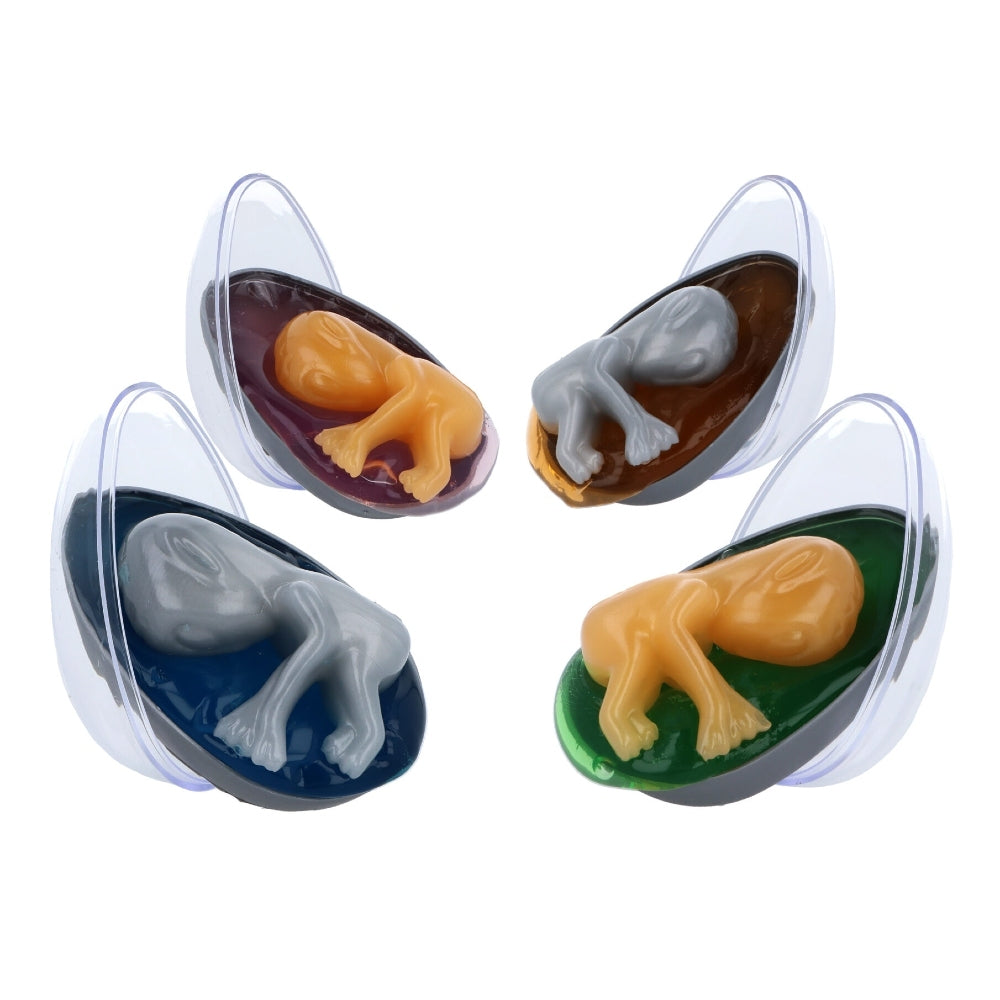 4 stretchy aliens in eggs surrounded by slime on a white background