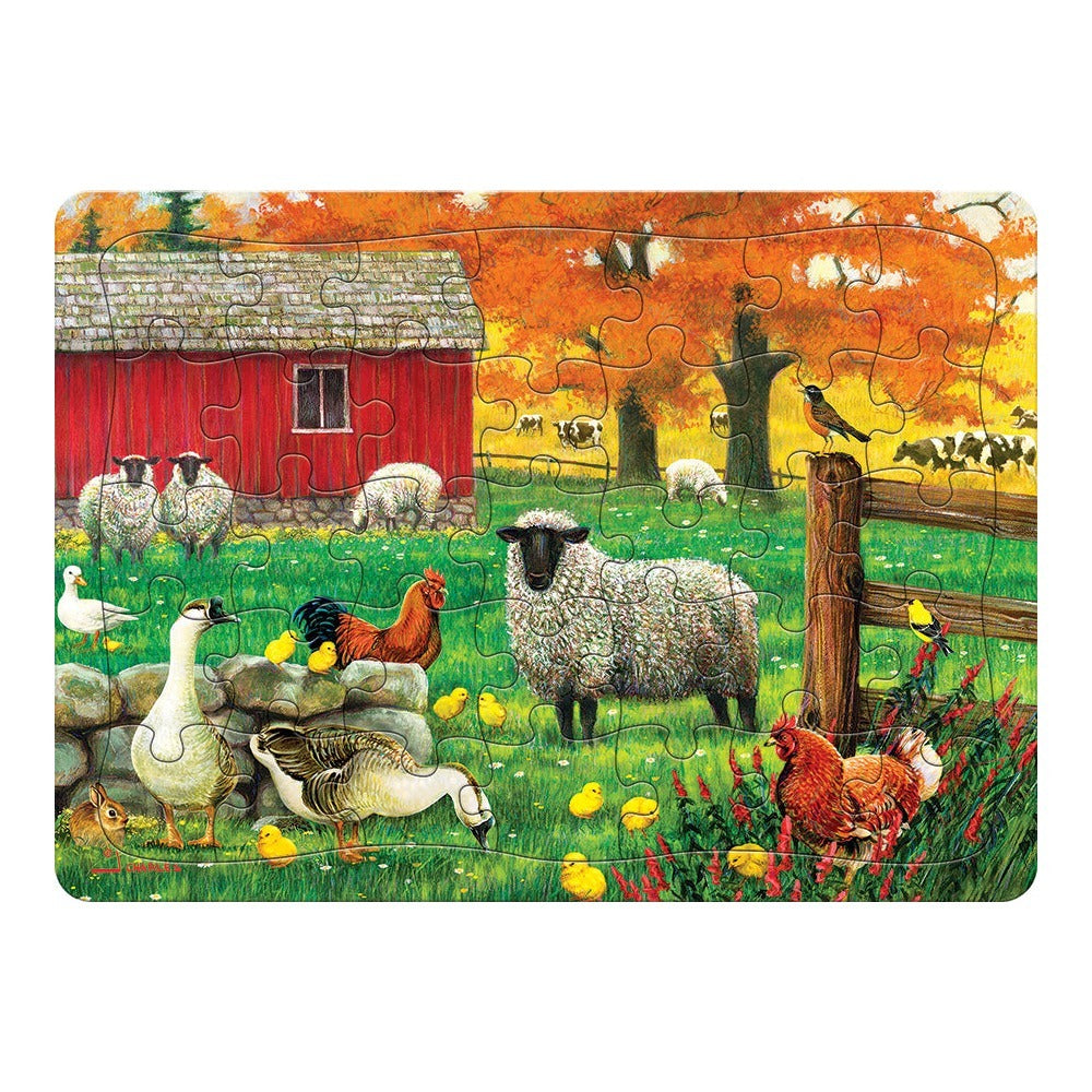 A cobble hill tray jigsaw puzzle depicting an autumn farm scene with sheep, chickens and cows