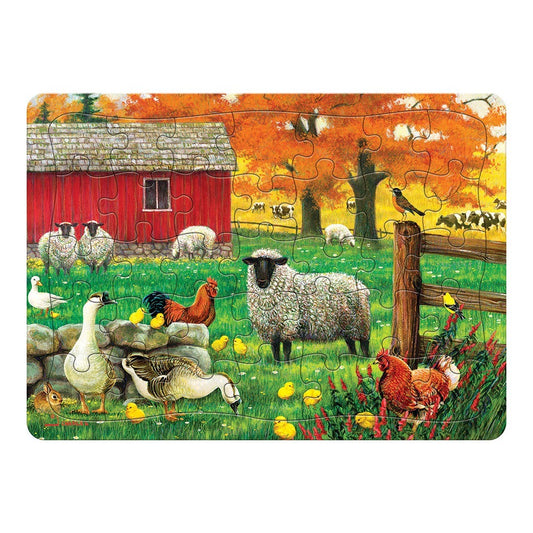 A cobble hill tray jigsaw puzzle depicting an autumn farm scene with sheep, chickens and cows