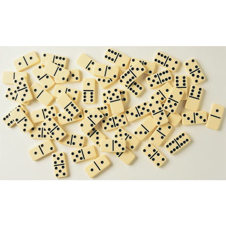 Set of cream and black dominoes on a white background