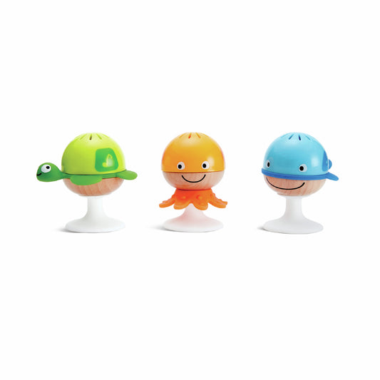 A set of three ocean themed baby rattles with suction cups on the bottom. Includes a whale, a turtle and an octopus