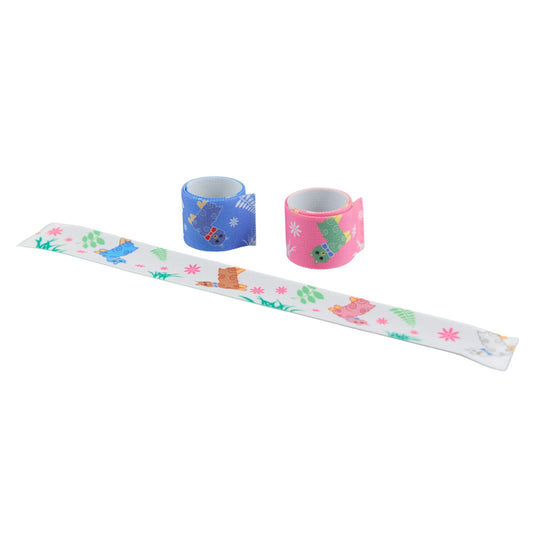 Three 'snap' bracelets, one pink, one white and one blue, with a llama design and various other graphics.