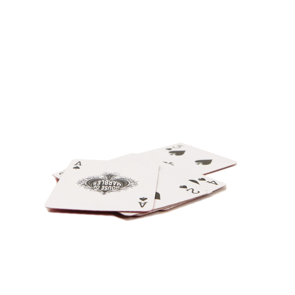 Four mini playing cards with a distinctive logo on a white background