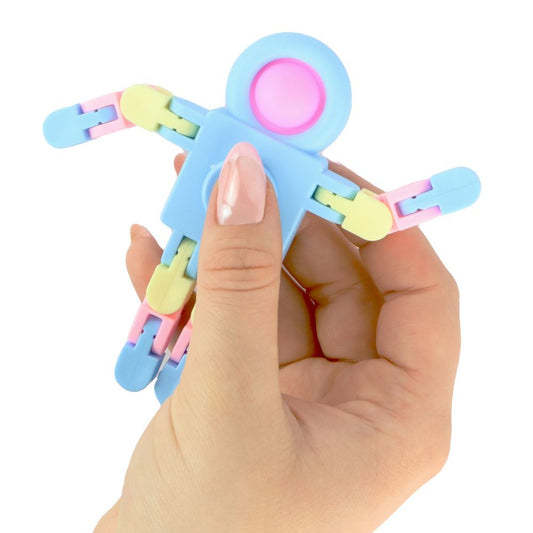 A hand. holding a pastel coloured fidget robot with a popper, fidget spinner and posable limbs