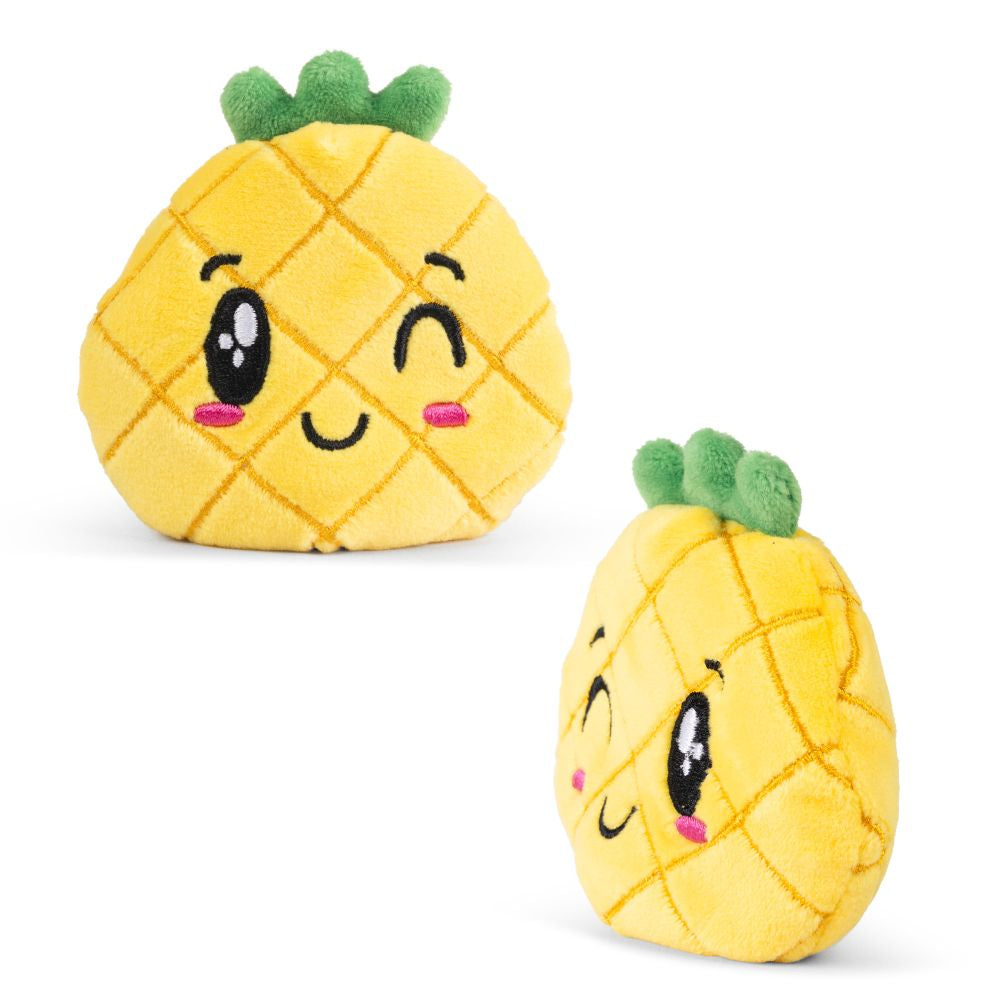 Two sand filled plush pineapple toys with faces on a white background