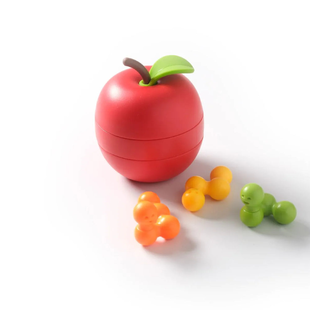 A red apple shaped puzzle in slices, with worm shaped pieces in front