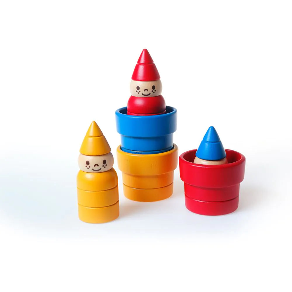 Colorful toy stacking plant pots with gnomes on a white background